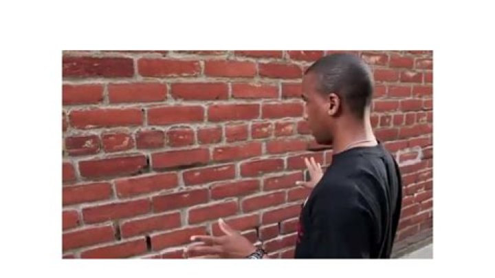 Man Talks to Brick Wall: Understanding the Symbolism, Psychology, and Impact